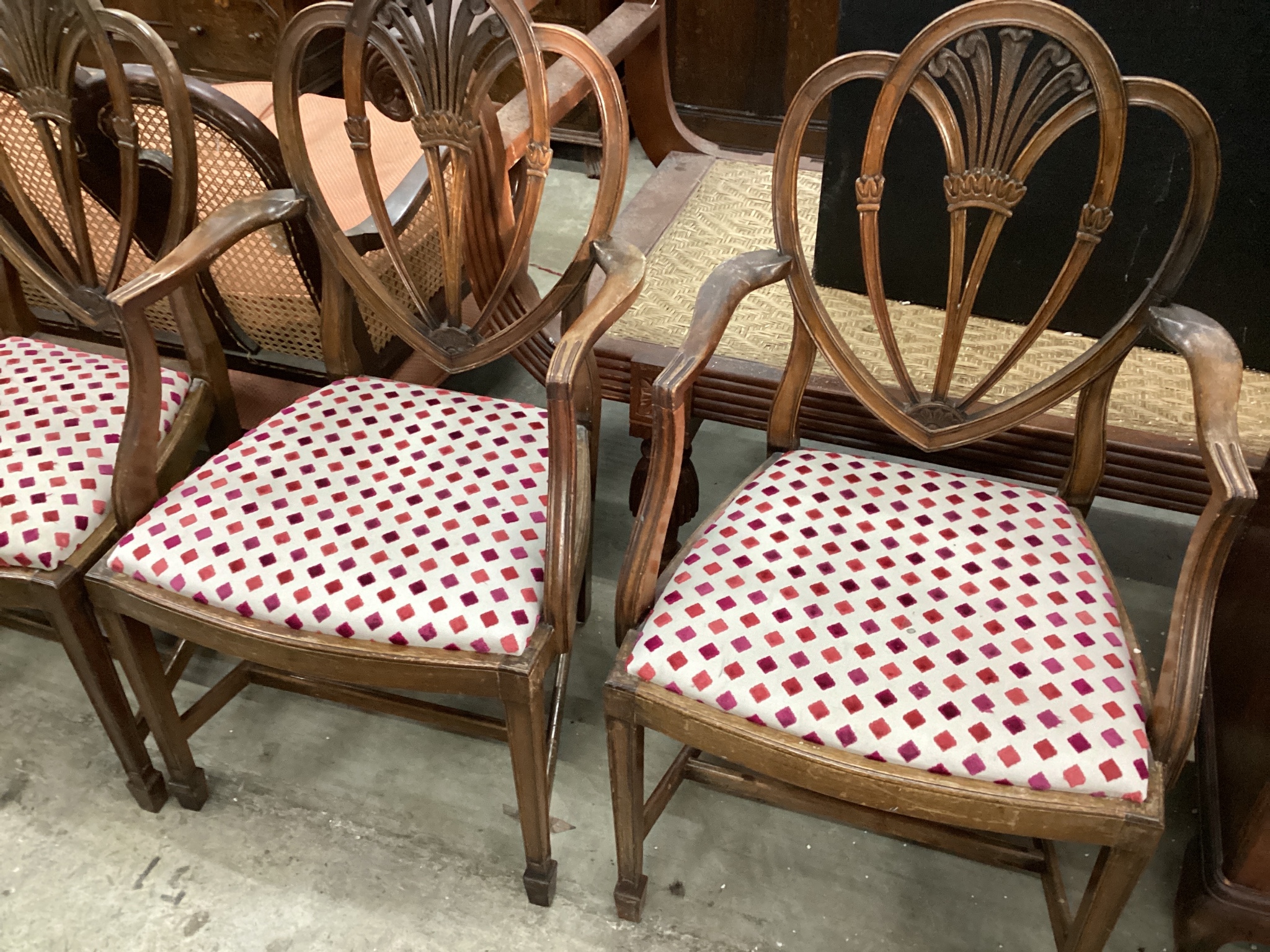 A set of eight Hepplewhite style mahogany dining chairs, two with arms